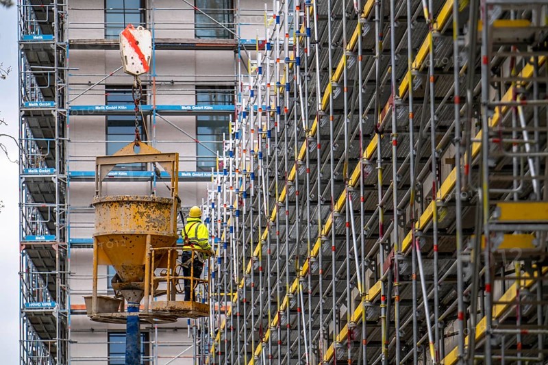 Concreting work on a construction site, new construction of a high-rise office building, facade of the shell, scaffolding, Cologne, North Rhine-Westphalia, Germany, Europe