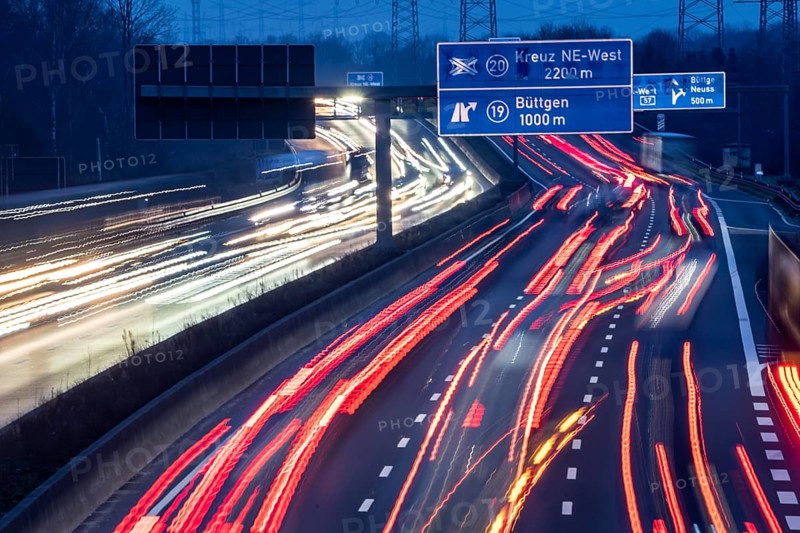 A57 motorway near Kaarst in the Rhine district of Neuss, view in the direction of the Büttgen junction, heavy evening traffic, overhead power lines, along the motorway, North Rhine-Westphalia, Germany, Europe