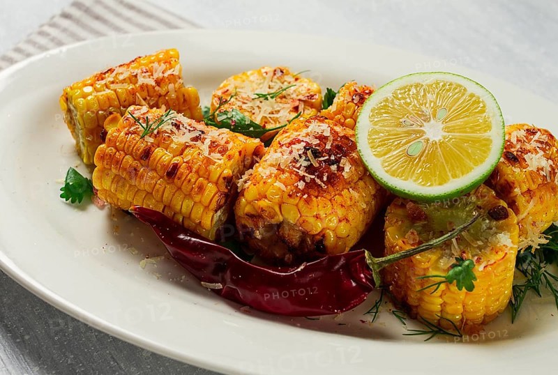Grilled corn with spices, top view, no people, homemade