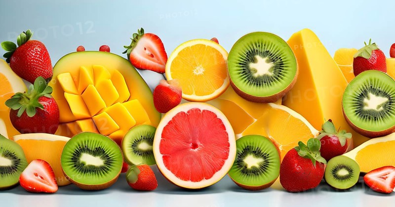 Colorful and artfully arranged slices of fruits like mangoes, strawberries, and kiwi, AI generated
