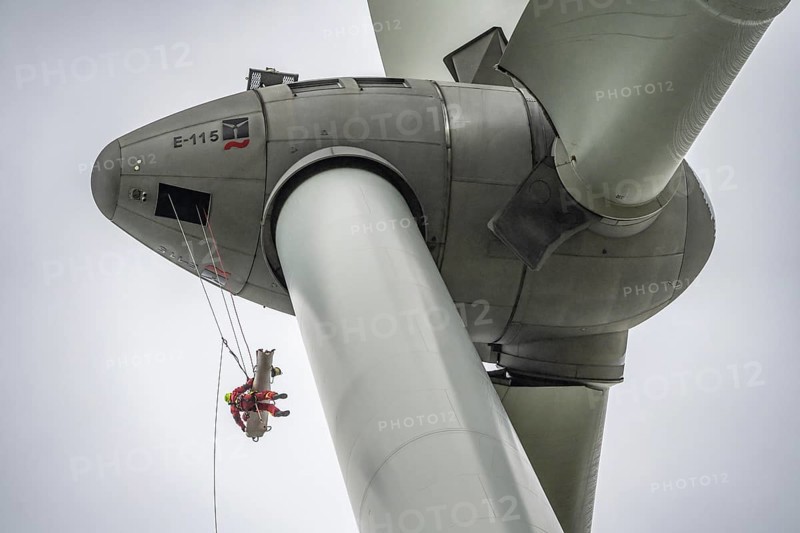 Height rescuers from the Oberhausen professional fire brigade practise abseiling from a wind turbine from a height of 150 metres, rescuing an injured person, technician, from the nacelle, Issum, North Rhine-Westphalia, Germany, Europe