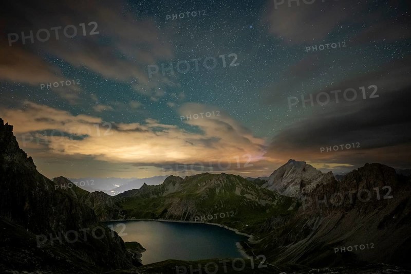 Starry sky with Montafon mountains and Lüner See, Tschagguns, Rätikon, Montafon, Vorarlberg, Austria, Europe