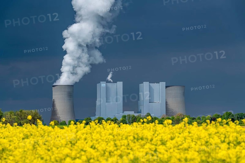 Neurath lignite-fired power station, near Grevenbroich, RWE Power AG, storm clouds over the Rhenish lignite mining area, rape field, North Rhine-Westphalia, Germany, Europe