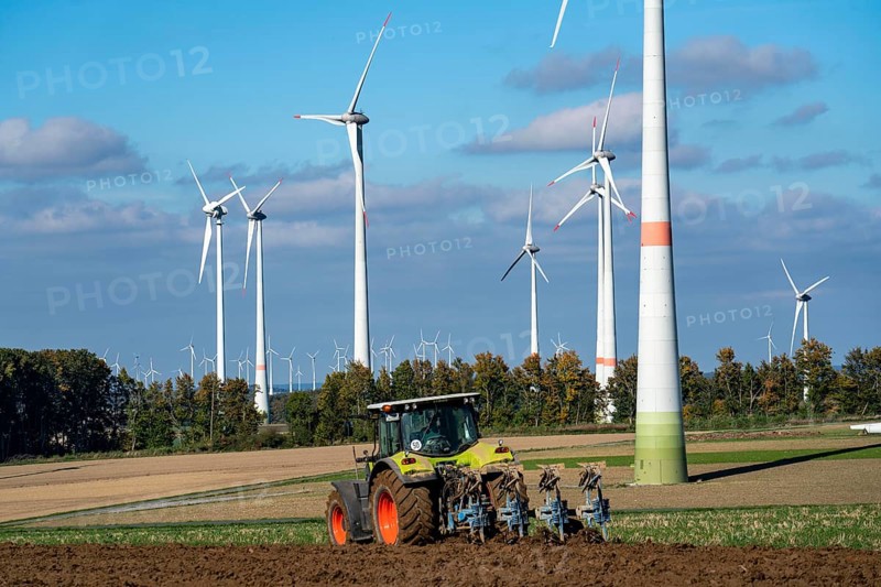 Farmer working in the fields, with a tractor, wind farm above the village of Lichtenau, self-proclaimed energy town, Paderborn district, OWL, A North Rhine-Westphalia, Germany, Europe