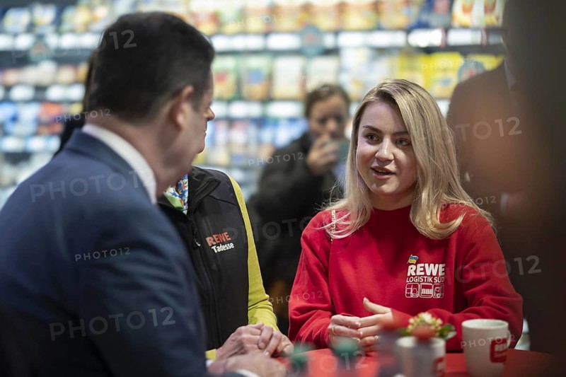 Hubertus Heil (SPD), Federal Minister of Labour and Social Affairs in conversation with Ukrainian refugees who are employed in various areas of REWE Group. Berlin, 27 February 2024