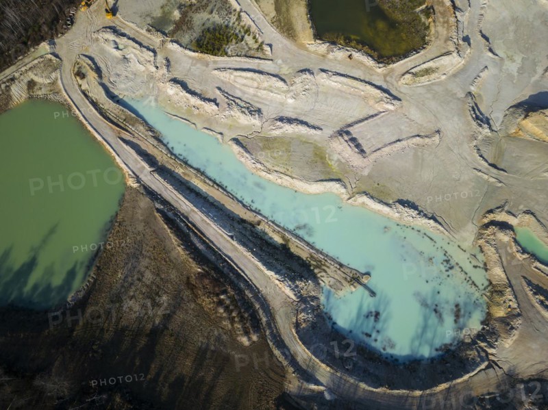 The Blue Hole, a residual hole from the kaolin mining operations of Kaolin- und Tonwerke Seilitz-Löthain GmbH, is now a natural paradise, but can only be entered by anglers, Ockrilla, Saxony, Germany, Europe