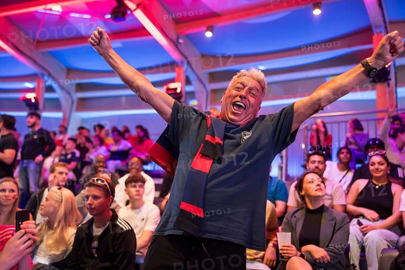 A fan of the British team celebrates the equaliser at the Adidas fan zone at the Bundestag during the final match between Spain and England at the European Football Championship, Berlin, 14.07.2024
