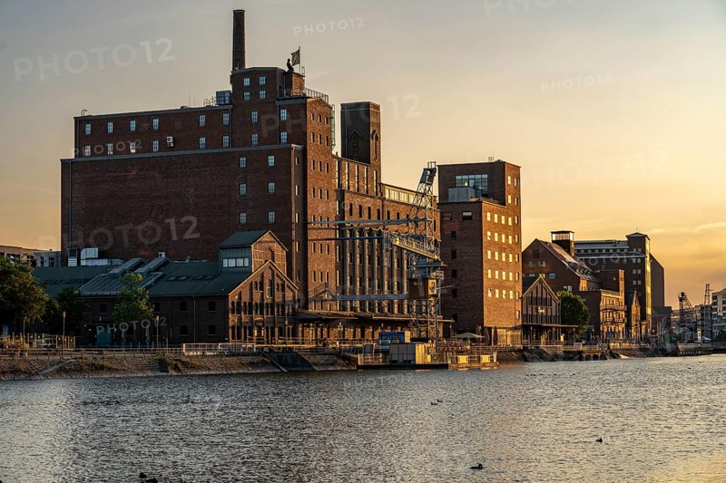 The inner harbour, in Duisburg, Werhahn-Mühle building on the left, granary with Explorado Children's Museum, Faktorei 21 building on the right, North Rhine-Westphalia, Germany, Europe