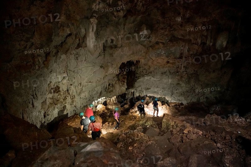 Visitors in a stalactite cave, Terciopelo Cave, Barra Honda National Park, Costa Rica, Central America