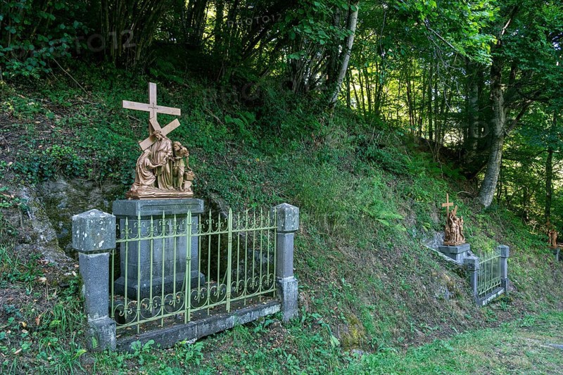 Orcival in Auvergne Volcanoes Regional Natural Park, Statues of Christ's Way of the Cross. Puy de Dome. Auvergne-Rhone-Alpes. France