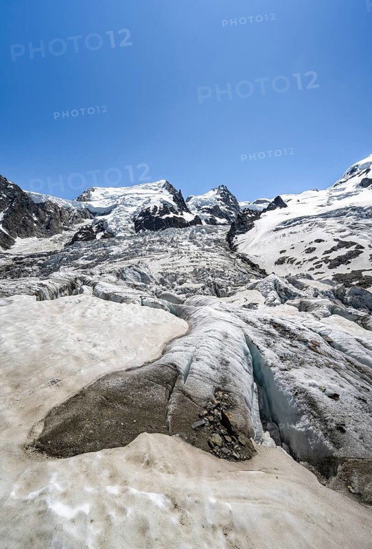 High alpine glaciated mountain landscape, La Jonction, Glacier des Bossons meets Glacier de Taconnaz, summit of Mont Maudit and Mont Blanc, Chamonix, Haute-Savoie, France, Europe