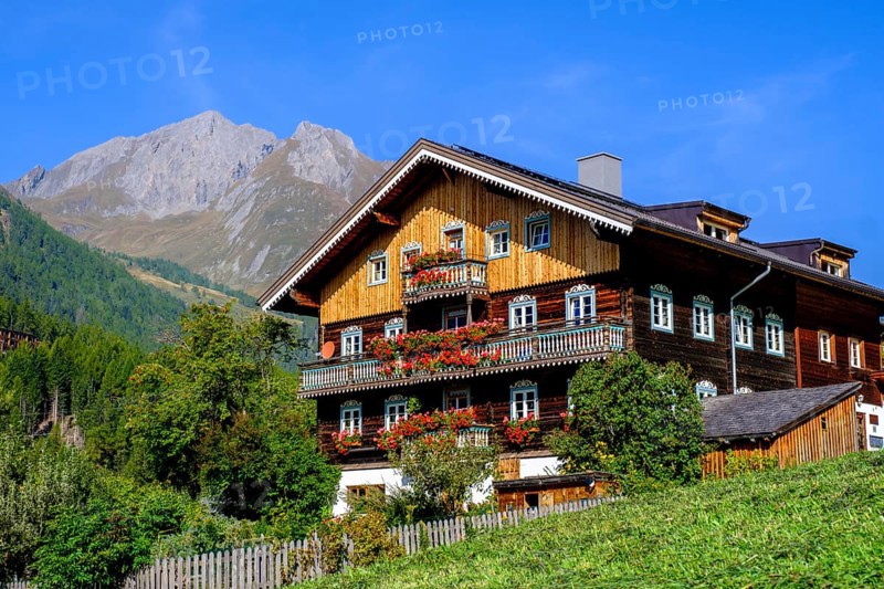 Farmhouse decorated with flowers. Burg district, Kals am Großglockner, East Tyrol, Austria, Europe