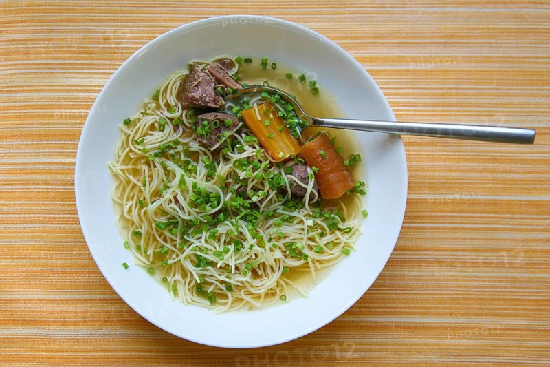 Swabian cuisine, Swabian noodle soup, soup, meat broth with noodles, chives, carrots, carrots, yellow turnips and boiled meat, beef, soup meat, plate, hearty, savoury, typical Swabian, traditional cuisine, food photography, studio, Germany, Europe