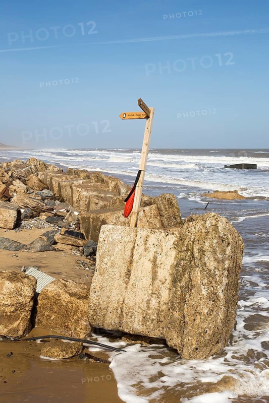 March 20 2018 Hemsby, UK. Coast path sign left abandoned by coastal erosion at Hemsby, Norfolk, England, UK