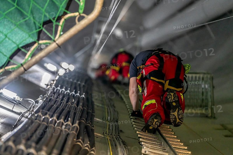 Height rescuers from the Oberhausen professional fire brigade practise abseiling from a wind turbine from a height of 150 metres, ascent into the turbine, to the nacelle, Issum, North Rhine-Westphalia, Germany, Europe