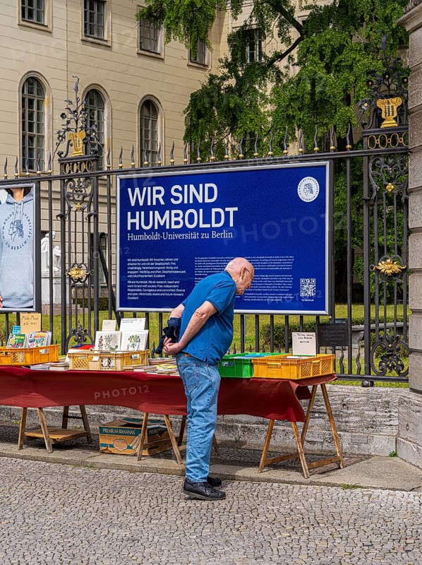 Tourists at the flea market stall in front of Humboldt University, Unter den Linden, Berlin, Germany, Europe