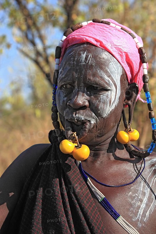 South Ethiopia, in Maco National Park, Mursi tribe, Mursi woman with painted skin and earrings, Ethiopia, Africa
