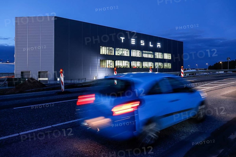 A car drives past the battery factory of the Tesla plant, Grünheide, 13.01.2023