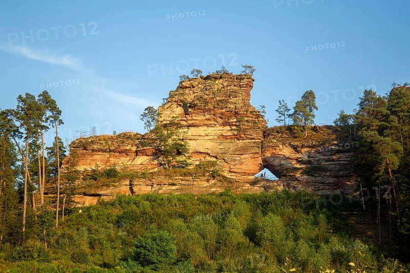 Büttelsfelsen Dahn natural monument in the evening sun. The striking rock massif is a red sandstone reef in Dahner Felsenland