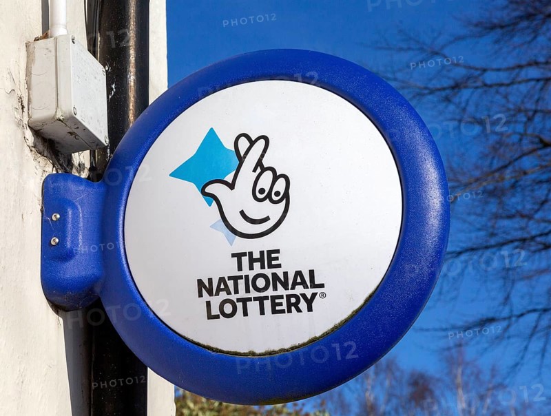 Close up of The National Lottery fingers crossed sign, UK