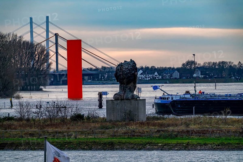 Flood on the Rhine near Duisburg, freighter in the harbour canal, Neuenkamp Rhine Bridge, old and new construction, landmark Rhine Orange, washed by the flood, sculpture The Echo of Poseidon, on Mercator Island, washed by the flood, North Rhine-Westphalia, Germany, Europe