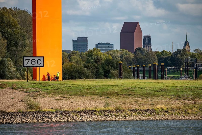 The sculpture Rhine Orange at the mouth of the Ruhr into the Rhine, skyline of the city centre of Duisburg, tower of the North Rhine-Westphalia State Archive, town hall tower and Salvator Church, North Rhine-Westphalia, Germany, Europe