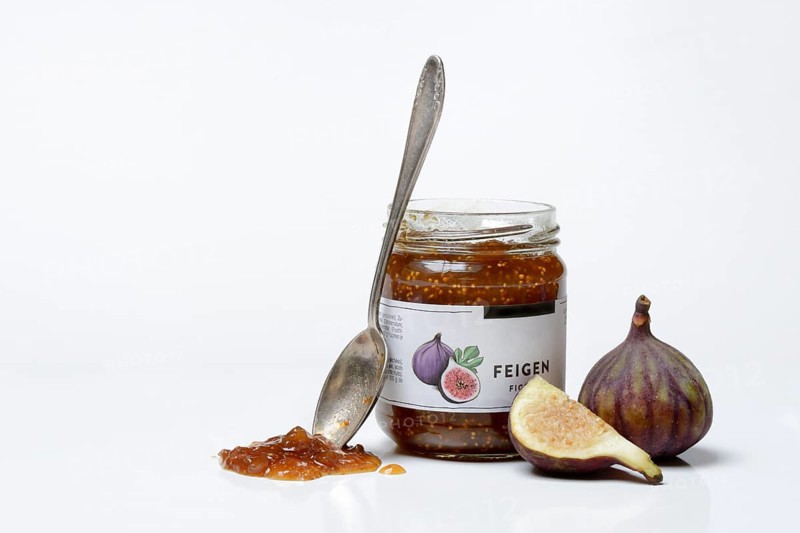 Fig jam in a jar and fresh figs, Ficus carica