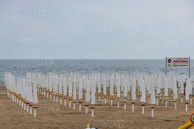Bagni Lungomare, Chioggia. Bathing beach on the Adriatic in bad weather. All deckchairs are free. Chioggia, Veneto, Italy, Europe