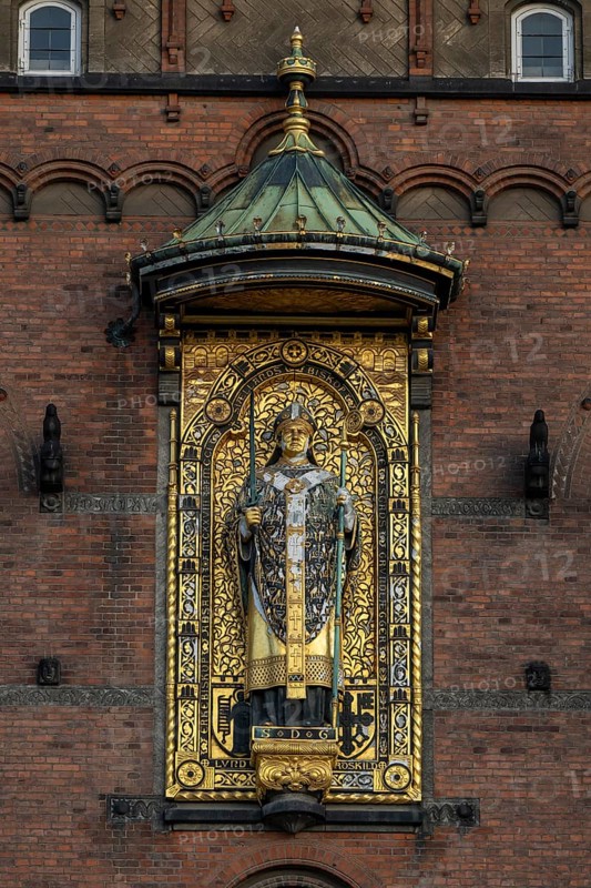 Brick façade with gilded sculpture of Bishop Absalon, Town Hall in the National Romantic style by Martin Nyrop, Town Hall Square, Rathausplatz or Rådhuspladsen, Copenhagen, Denmark, Europe