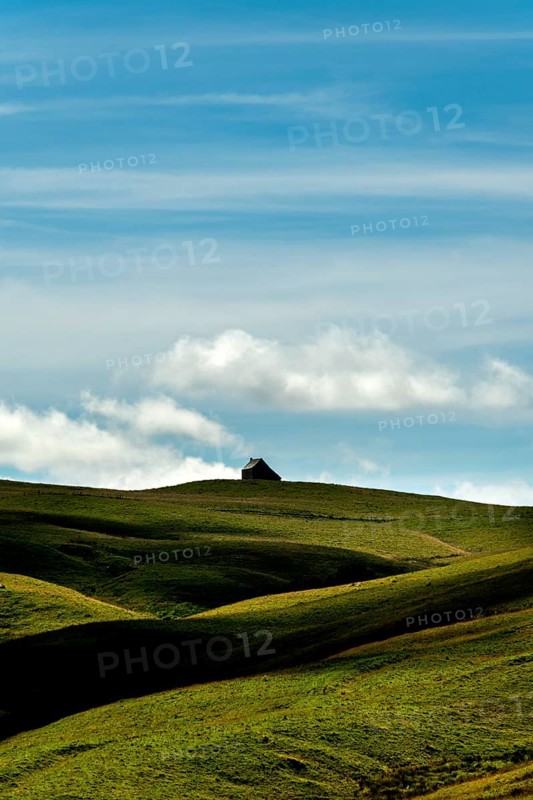 Isolated farm called buron on the Cezallier plateau in the Auvergne Volcanoes Regional Natural Park, Puy de Dome, Auvergne-Rhone-Alpes, France, Europe