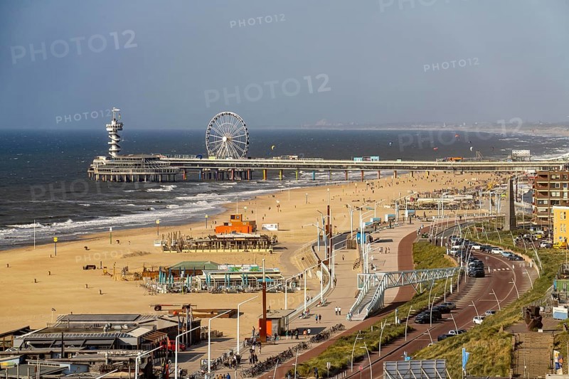 View over the beach of Scheveningen, the pier with Ferris wheel belongs to the city of The Hague and is the largest seaside resort in the Netherlands