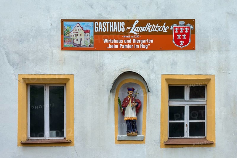 Figure of St Nepomuk in a niche at an inn, Sulzbach-Rosenberg, Upper Palatinate, Bavaria, Germany, Europe