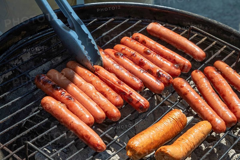 Detroit, Michigan, Hot dogs on the grill at the annual 'Summer Sizzler' picnic and party held by two Detroit Neighborhoods, Morningside and East English Village