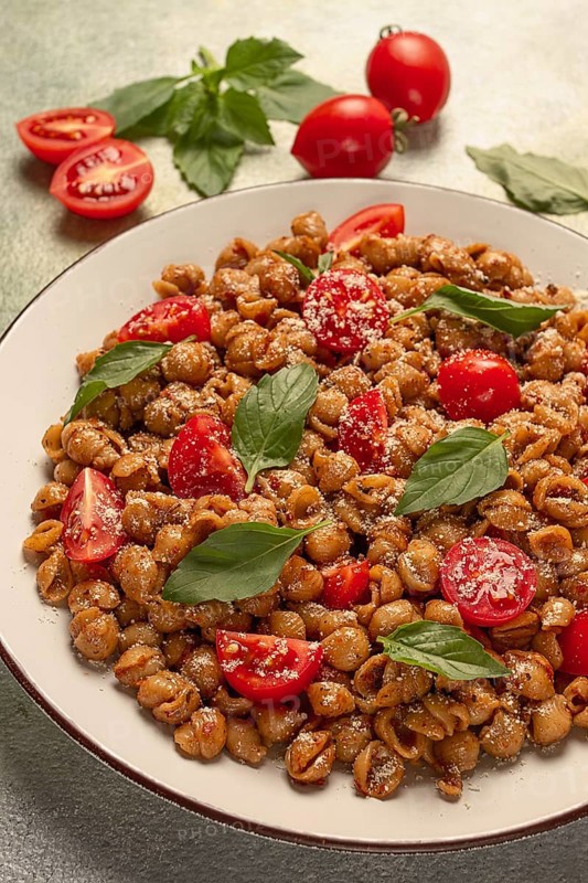 Tuscan pasta with smoked paprika and basil, parmesan cheese, Italian traditional cuisine