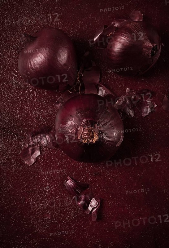 Red onion, fresh, raw, on a dark background, top view