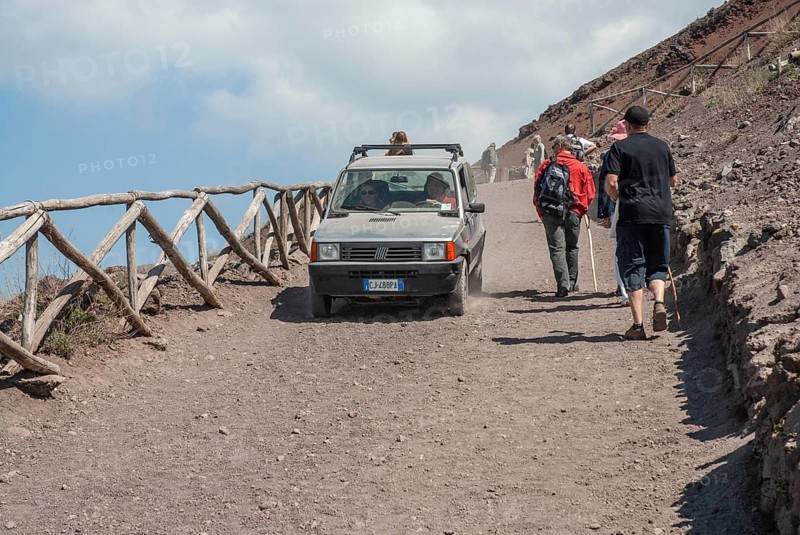 Car traffic and walking tourists on the path up to Vesuvius, near Naples, Parco Nazionale del Vesuvio, Campania, Italy, Europe