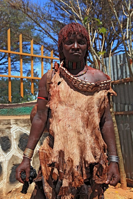 Southern Ethiopia, woman of the Hammer people in Dimeka, dress made of goatskin and hair dyed with a mixture of fat and ochre-coloured clay, Ethiopia, Africa