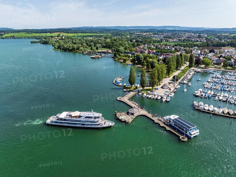 The yacht harbour, marina, harbour of Unteruhdlingen, Uhldingen-Mühlhofen with the passenger ship MS Überlingen of the Lake Constance-Schiffsbetriebe, behind it the pile dwellings, pile dwelling museum, Lake Constance district, Lake Constance, Baden-Württemberg, Germany, Europe