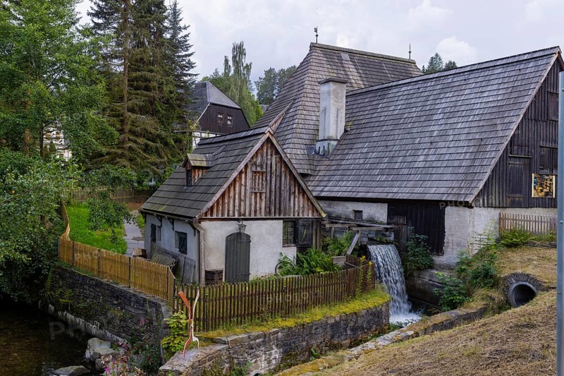 Situated on the Sehma, the Frohnau hammer became Saxony's first technical monument in 1907 and is Germany's oldest blacksmith museum. In addition to the hammer mill and the manor house, the museum complex includes an exhibition on forged products, a free-form hammer, a mechanical Heimatberg as well as a lace-making parlour and restaurant in the manor house. The monument is part of the Erzgebirge/Krušnohorí mining region, which has been a UNESCO World Heritage Site since 2019., Frohnauer Hammer, Annaberg Buchholz, Saxony, Germany, Europe
