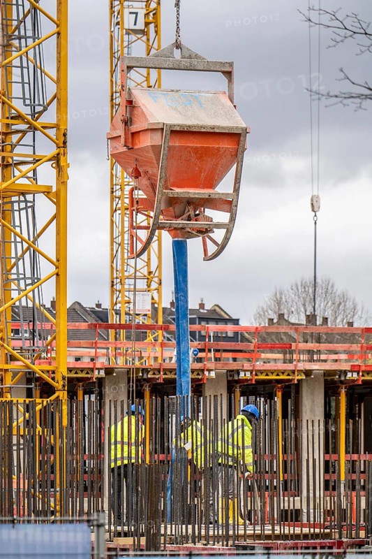 Concrete works, concrete bomb, on a large construction site, construction of a residential and commercial complex, North Rhine-Westphalia, Germany, Europe