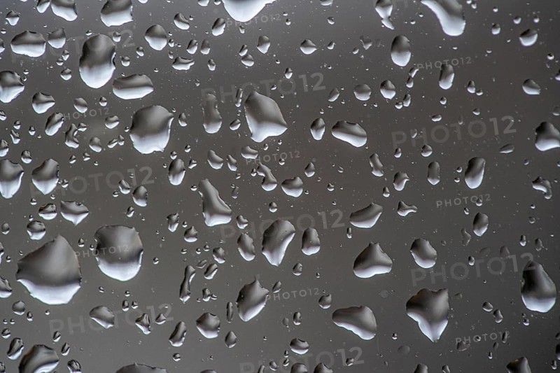 Rainy weather, raindrops on a window pane