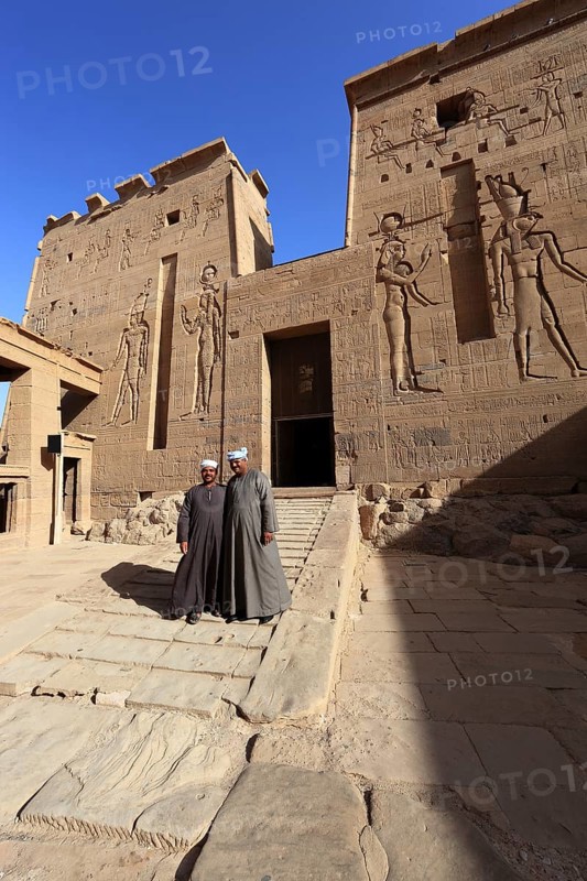 Temple of Isis, Temple of Isis at Philae on the island of Agilkia, two Arabs in front of the Temple of Isis, part of the temple complex, Africa, Upper Egypt, Egypt, Africa