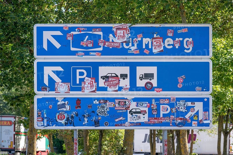 Motorway sign covered with stickers at a motorway service area, A6 motorway, Baden-Württemberg, Germany, Europe
