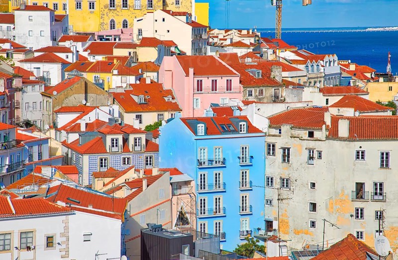 Scenic Alfama lookout with San Vicente (Saint Vincent) statue and Sao Vicente de Fora a church on the background