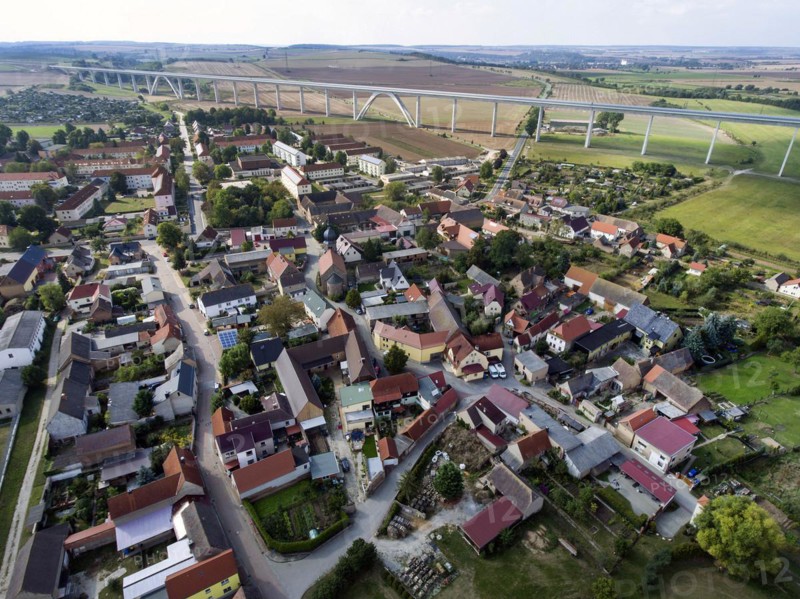 Aerial view of Karsdorf, which has been given a new landmark in the form of the Unstruttalbrücke bridge that can be seen in the background. The Unstruttal Bridge is a double-track railway bridge on the new Erfurt-Leipzig Halle line. With a length of 2668 metres, it is the second longest railway bridge in Germany, Karsdorf, 22.09.2016
