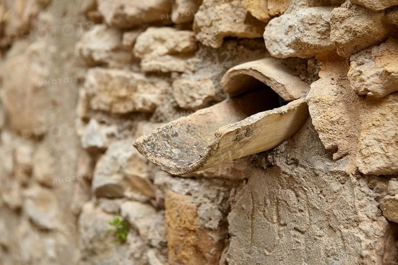 Natural stone wall with rainwater drain La Roque-sur-Cèze, Département Gard, Occitanie region, France, Europe