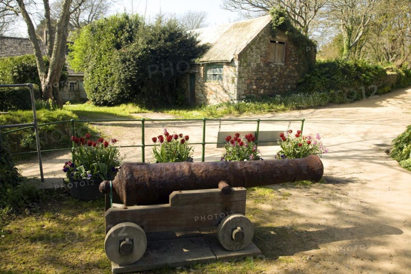 Old cannon and buildings Island of Sark, Channel Islands, Great Britain