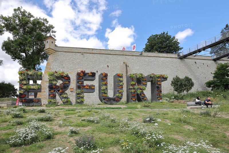 Lettering Erfurt with planting, greening, vertical garden, nature, green, bastion, two people sitting on park bench, guardhouse, guardhouse, citadel, Petersberg, Erfurt, Thuringia, Germany, Europe
