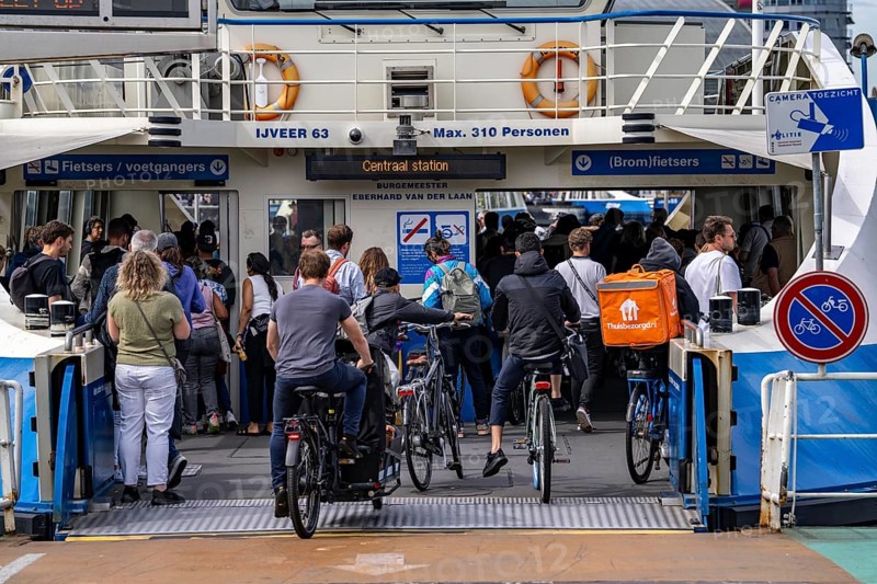 GVB ferries for pedestrians and cyclists across the river Ij, at Amsterdam Centraal station, free of charge, to the eastern parts of the city, Netherlands