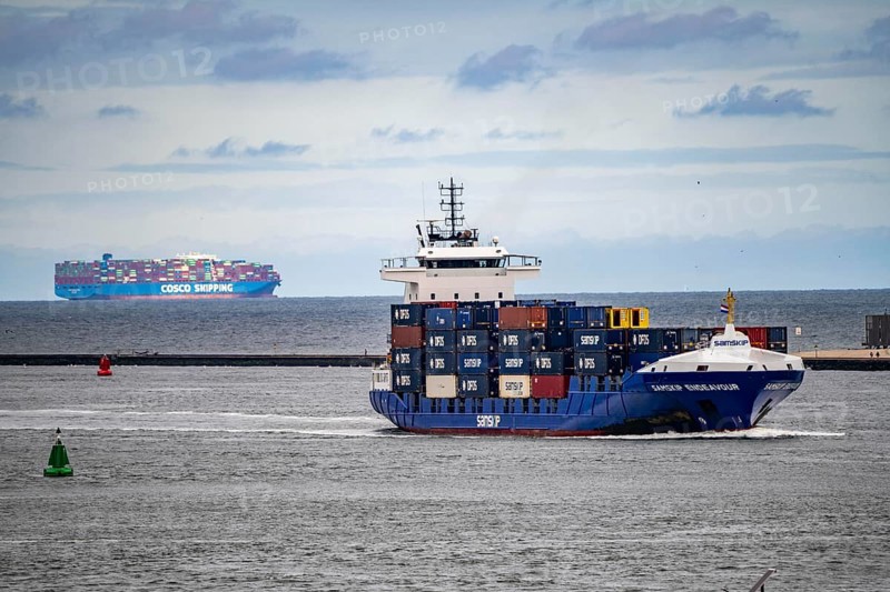 Entry to the seaport of Rotterdam, container freighter, feedership, Samskip Endeavour, enters the port of Rotterdam, Cosco Shipping Aries container ship departs, Nieuwe Waterweg, Netherlands